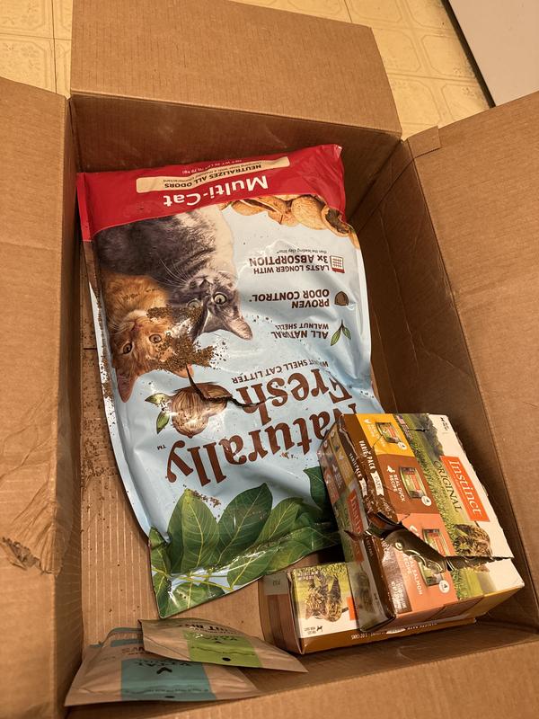 Damaged cat litter bag with rest of the order