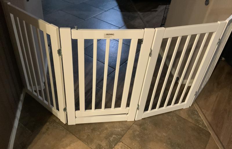 The door in this gate is easy to open and close when you want to go though without unfolding the gate.