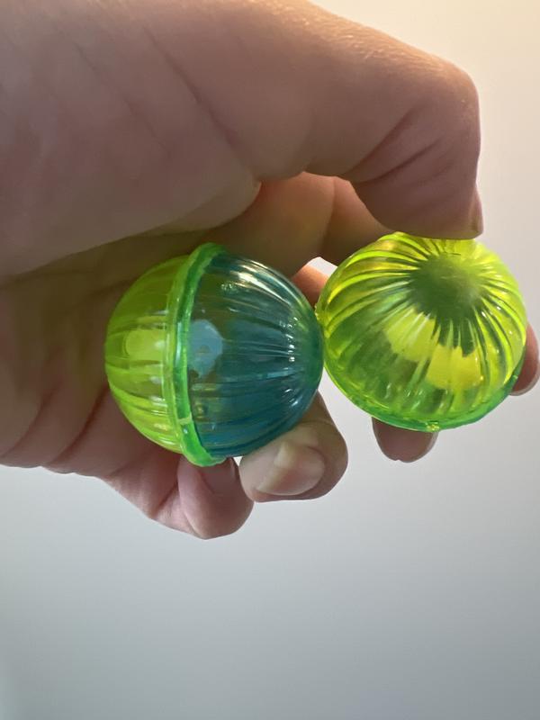 side by side comparison. two bells in one, the other stuck to the wall of the ball