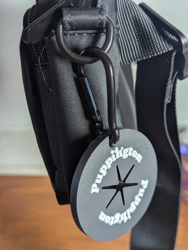 This silicone thing holds onto waste bags. I double knot the waste bag so there's more surface area for this to grip to.