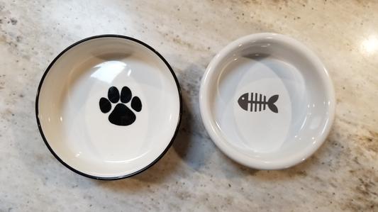 Old paw print bowl versus New fishbone bowl.