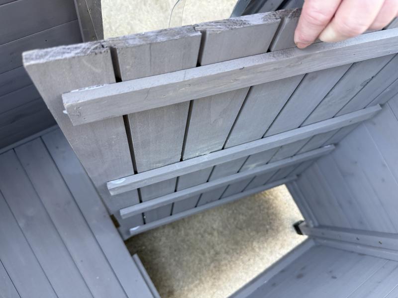 Bottom is divided in two pieces and you can lift to remove for cleaning.