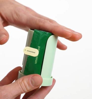 Load your poop bag roll so the first bag comes out through the slit.