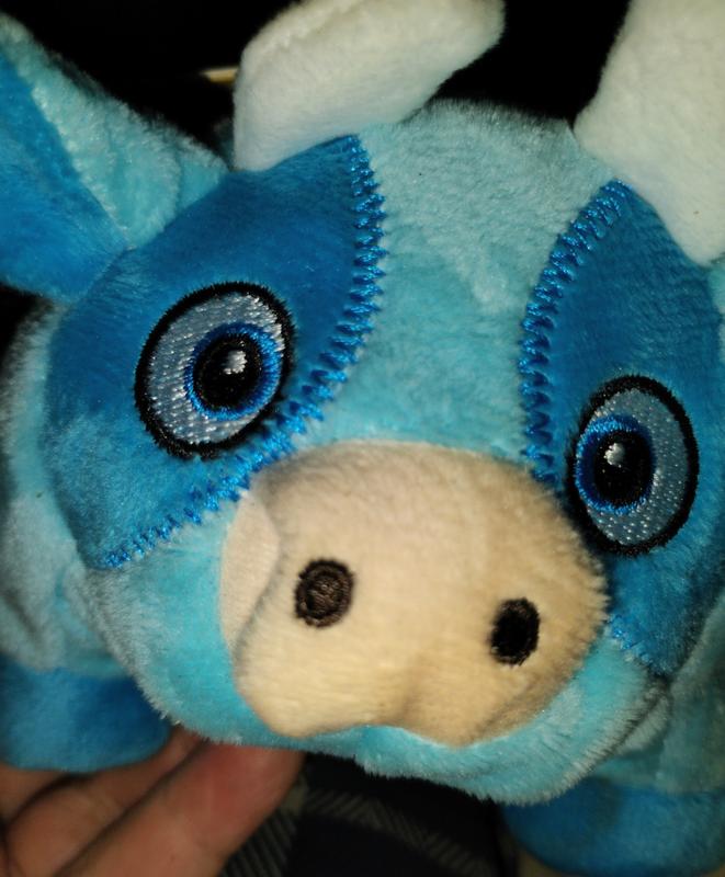 GROWL Trofflers Cow it's nose has been slobber on a lot already. Princess and the kittens love this cow toy.