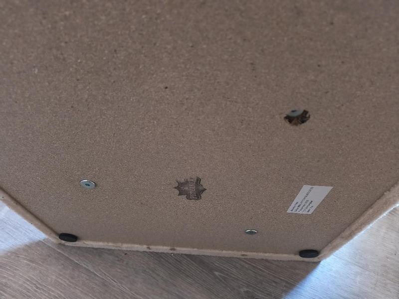 underneath where screw got embedded into cheap plywood causing bed to lean and is unrepairable.
