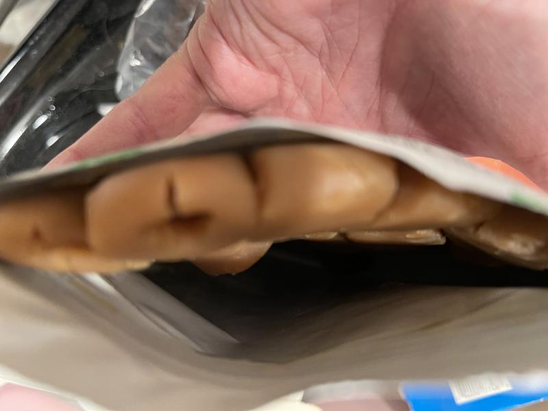 Squashed. The holes for the meds are gone.