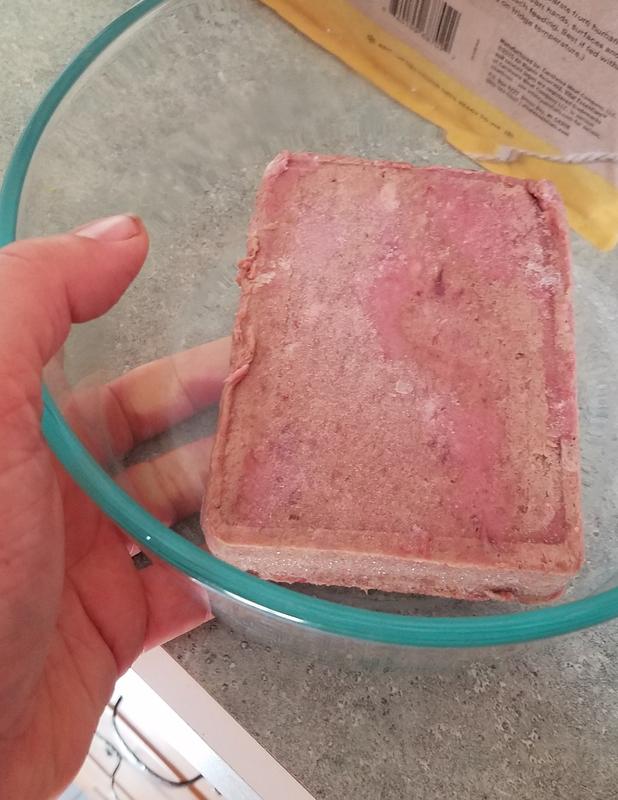 What one half pound patty looks like straight out of the bag and still frozen.  The patties are stacked loose inside the bag, but pop apart easily.