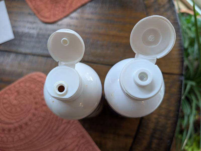 New bottle on left, old bottle on right. Right has a nice top to regulate the flow.