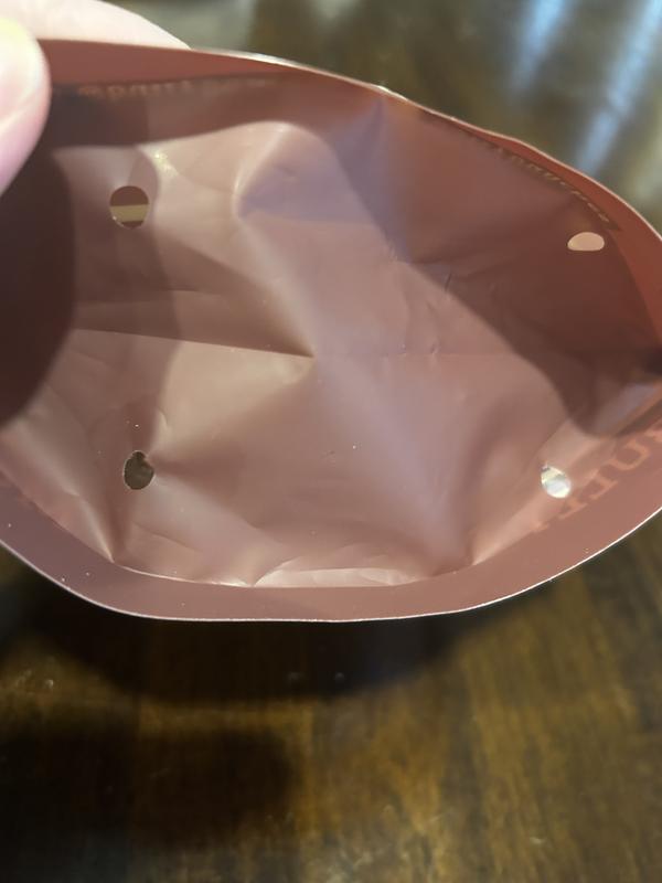 Note the holes in the bottom of the packaging