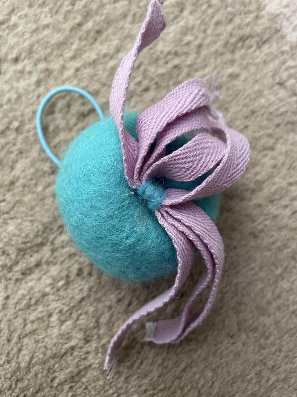 Close up of the fabric that attaches the "tentacles" to the ball.  I didn't add this fabric, it's original to the toy.  The sisal strings were threaded through the fabric loop and sewn in place.