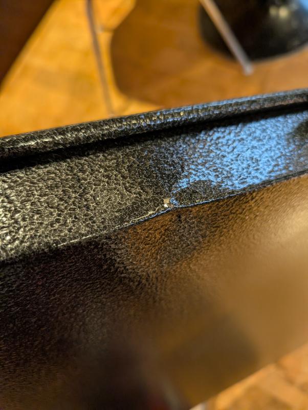 dented metal, chipped paint.