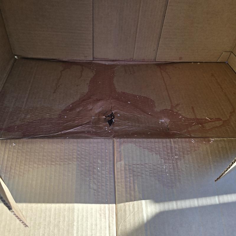 Stained box after removal of package.