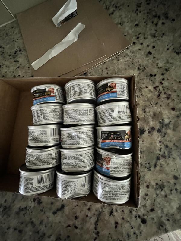 15 dented cans of wet food in the same case