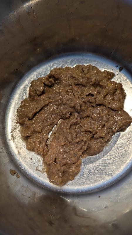 Soupy 'pate', used to be firm; can also changed, less food, heavier cans.