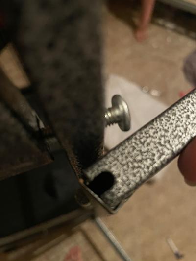 Metal coming apart from door. Bottom door does not do this.