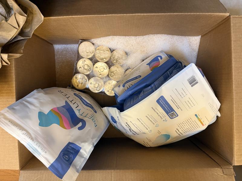 One of the bags of cat litter was sliced open from being thrown on top of the cat food case, and emptied into the shipping box. This cat litter is $25 per bag…