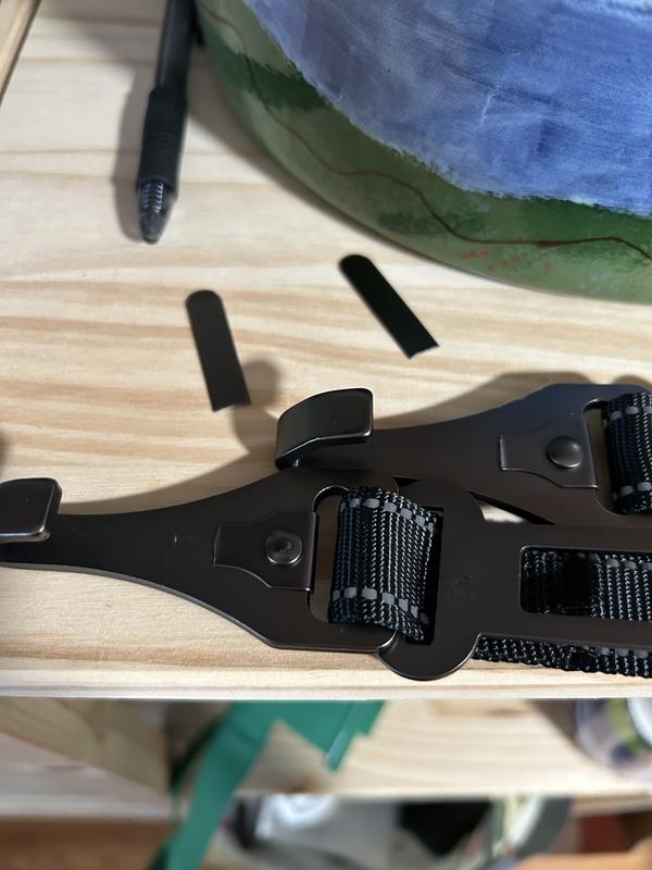 Image of two dog car seatbelts with broken pieces