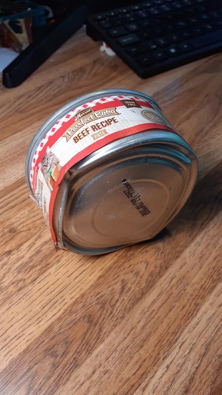 Beat-up Cat food can, Swollen