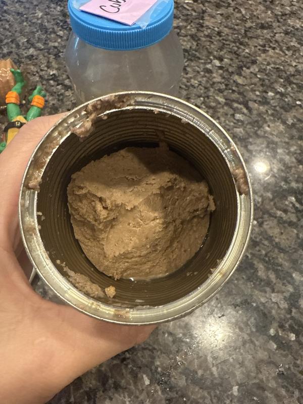 Very tightly packed, there is zero liquid just processed food.