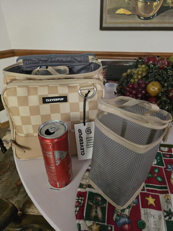 Travel kit next to energy drink for size comparison
