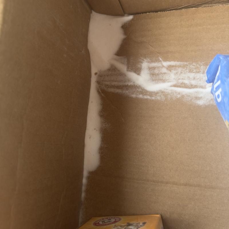Powder leaked out because of crushed box.