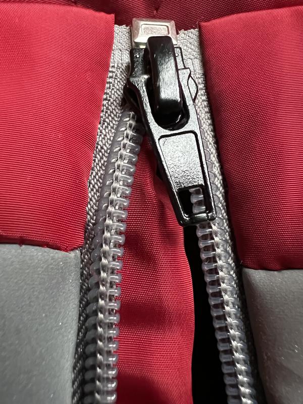 The flange inside the zipper gets stuck