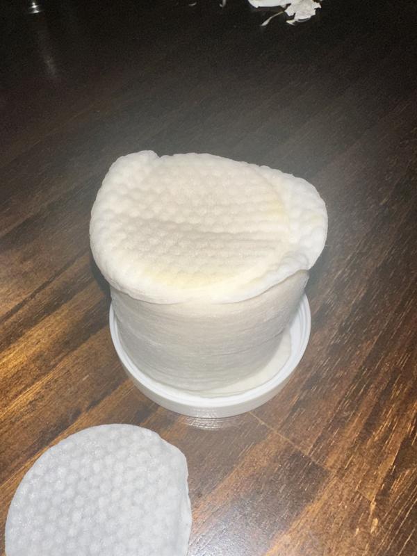 Wipes stack from inside the jar, showing yellowed pads.