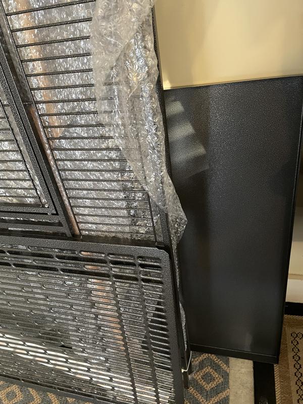 Tray is metal not plastic with an attachable handle