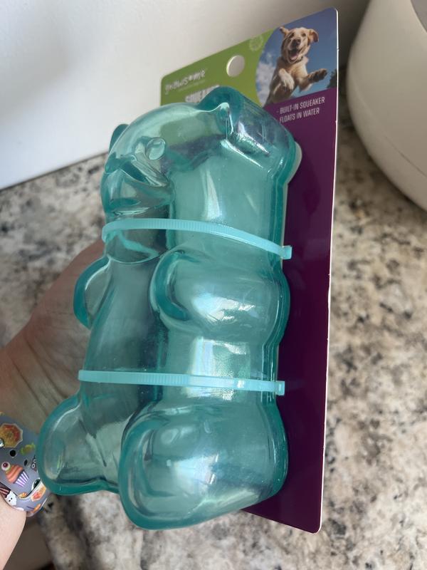 Grown female adult hand holding the toy.