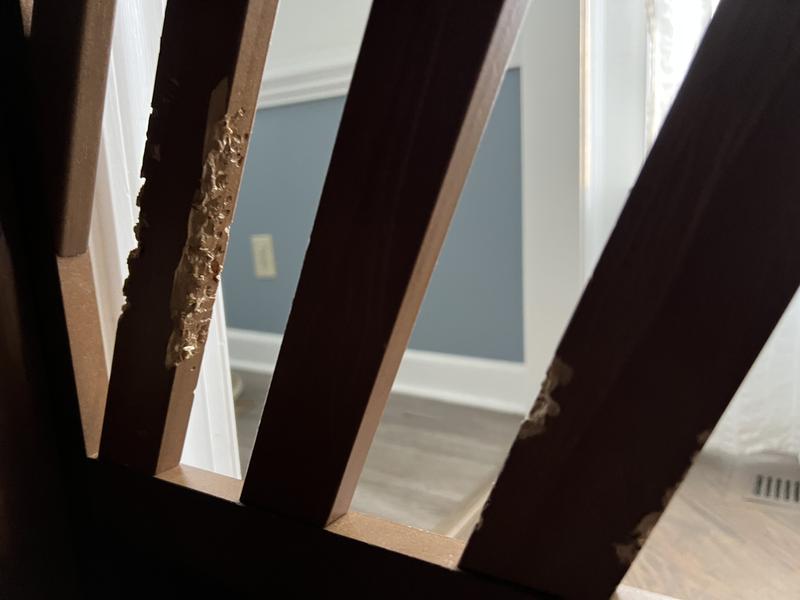 View of torn up wood lattice from inside the crate