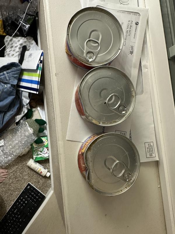 Dented and covered in something. Muddled can is slightly bulging. Shipping be was in perfect condition so the case of food was sent like this.