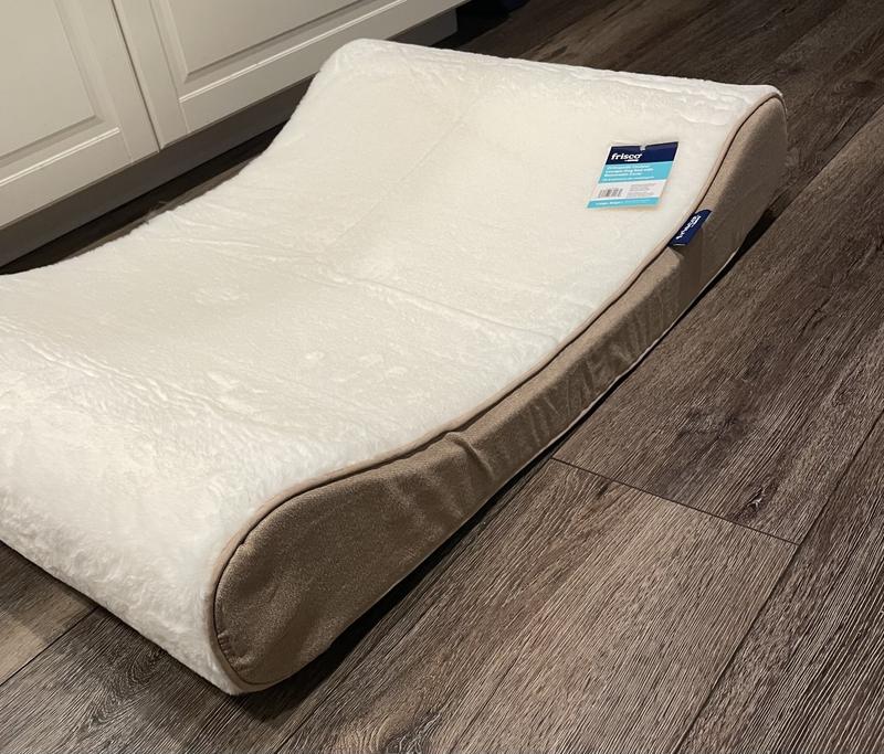 Bed is a good size, and has raised sides.