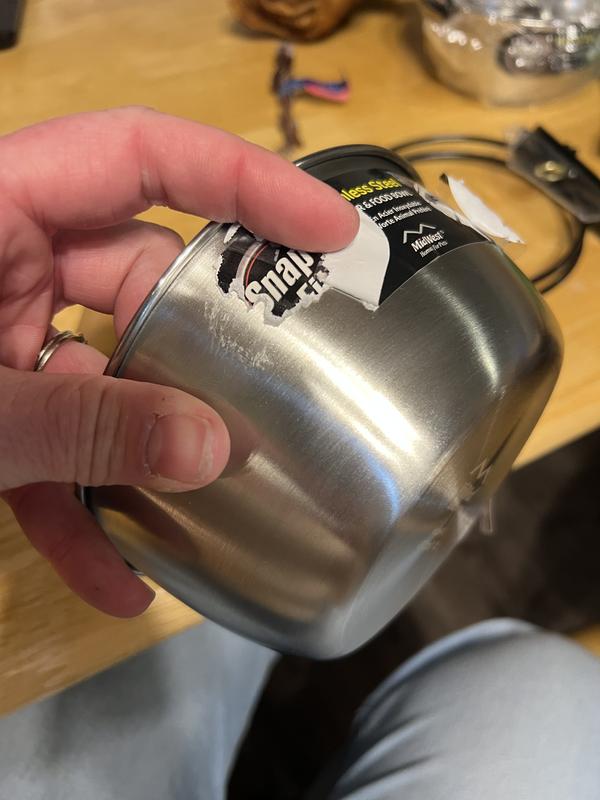 5 mins to get this far in removing the sticker on the side.