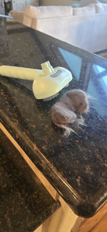 The hair popped off easily with the button.