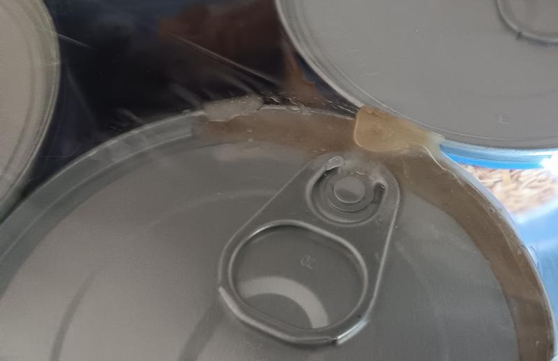 Cans in all 6 boxes were crushed, leaking or dented