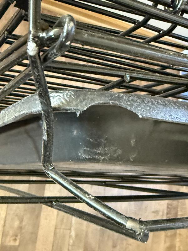 The corner of the crate had a chip missing from the plastic tray and the wire covering was scraped off two spots. This could open it up to rust or scraping your floors…