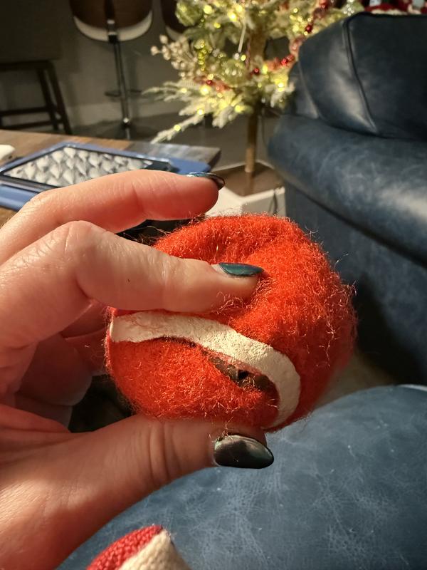 Broken in multiple places. Fabric separating from inner rubber ball.