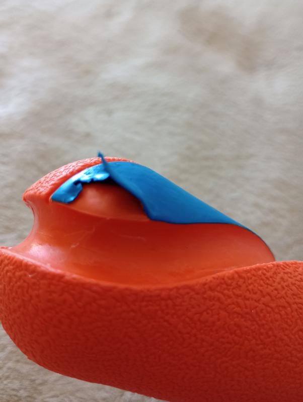 Blue plastic tearing off