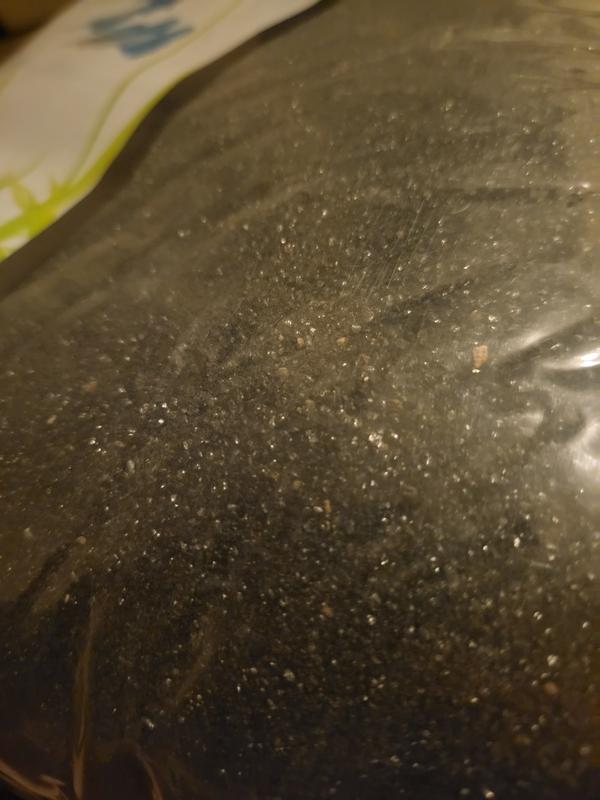 Photo shows close up of fine substrate inside of it's original packaging