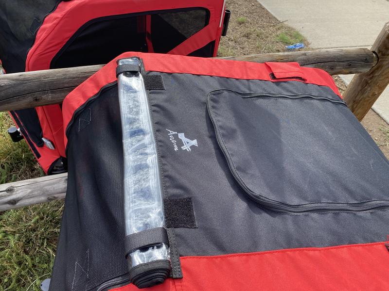 Rain flap that rolls up when not in use.