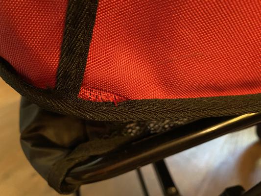 Fraying by right back corner of carriage