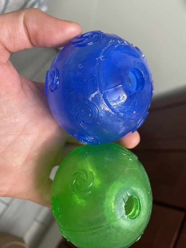new blue ball of poorer quality (left/top), older green ball of better quality (right/bottom)