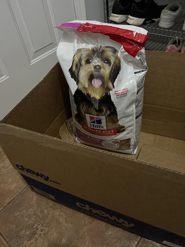 Pet food packaging with adhesive tape