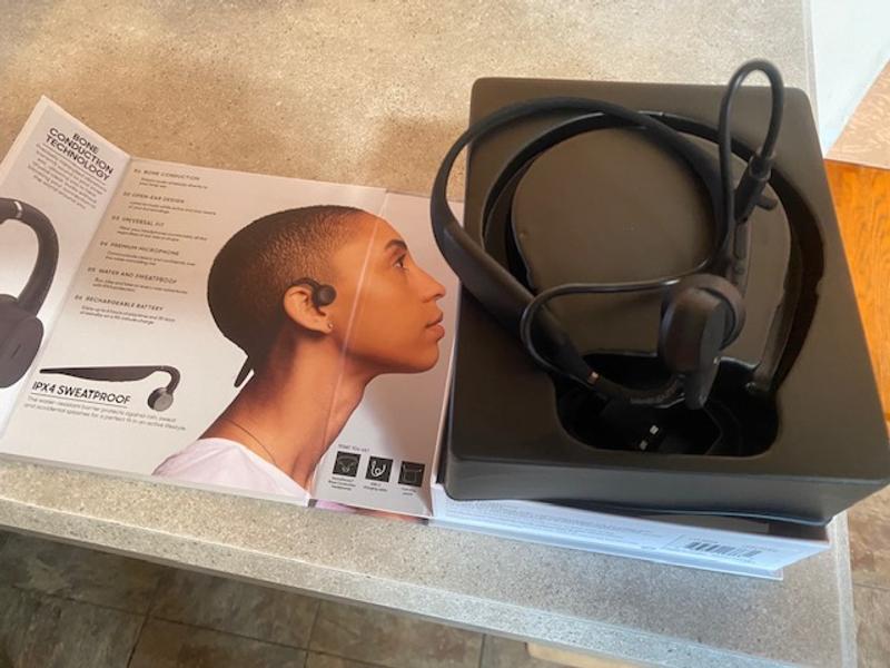 Small charging cord and a soft cary pouch come with the Headphones