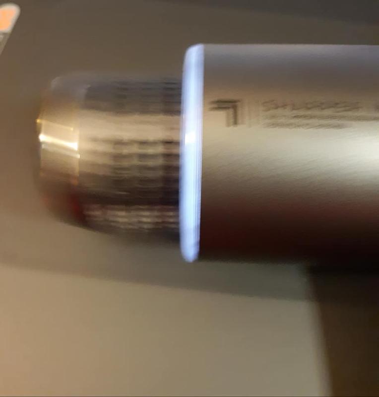 Blurry because it is in motion. The hot/ cold attachment.