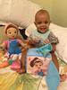 Happy baby girl with her new Ms. Rachel toys