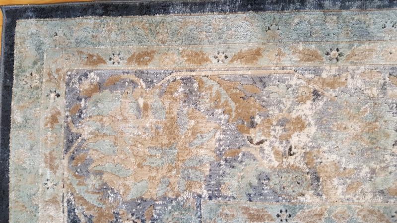 I love this lighter blue-green in the border along with the slightly darker blue-gray.  It makes an interesting contrast without competing with the main rug pattern.