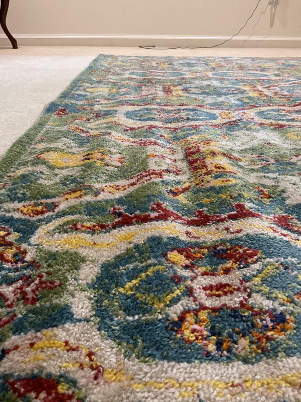 Bends in rug due to rolling to ship not on cardboard inner liner