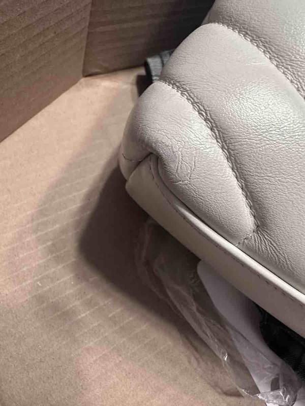 Customer photo for "damaged severely used handbag"