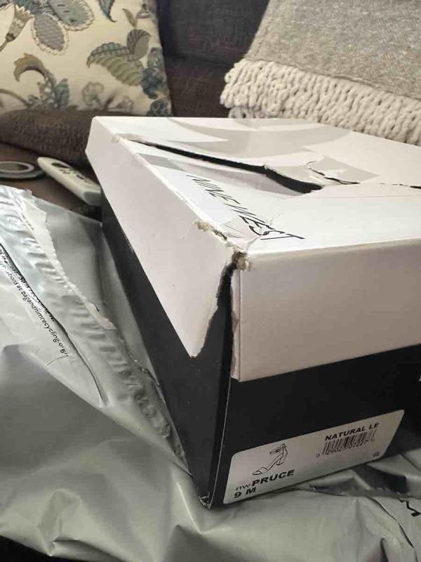Customer photo for "the box is beat up and the shoes were used."